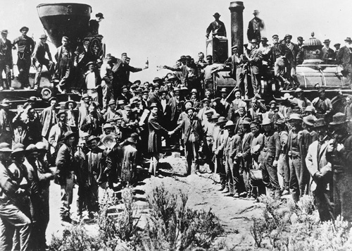 Crowd gathered between two locomotives at Promontory Summit in 1869.